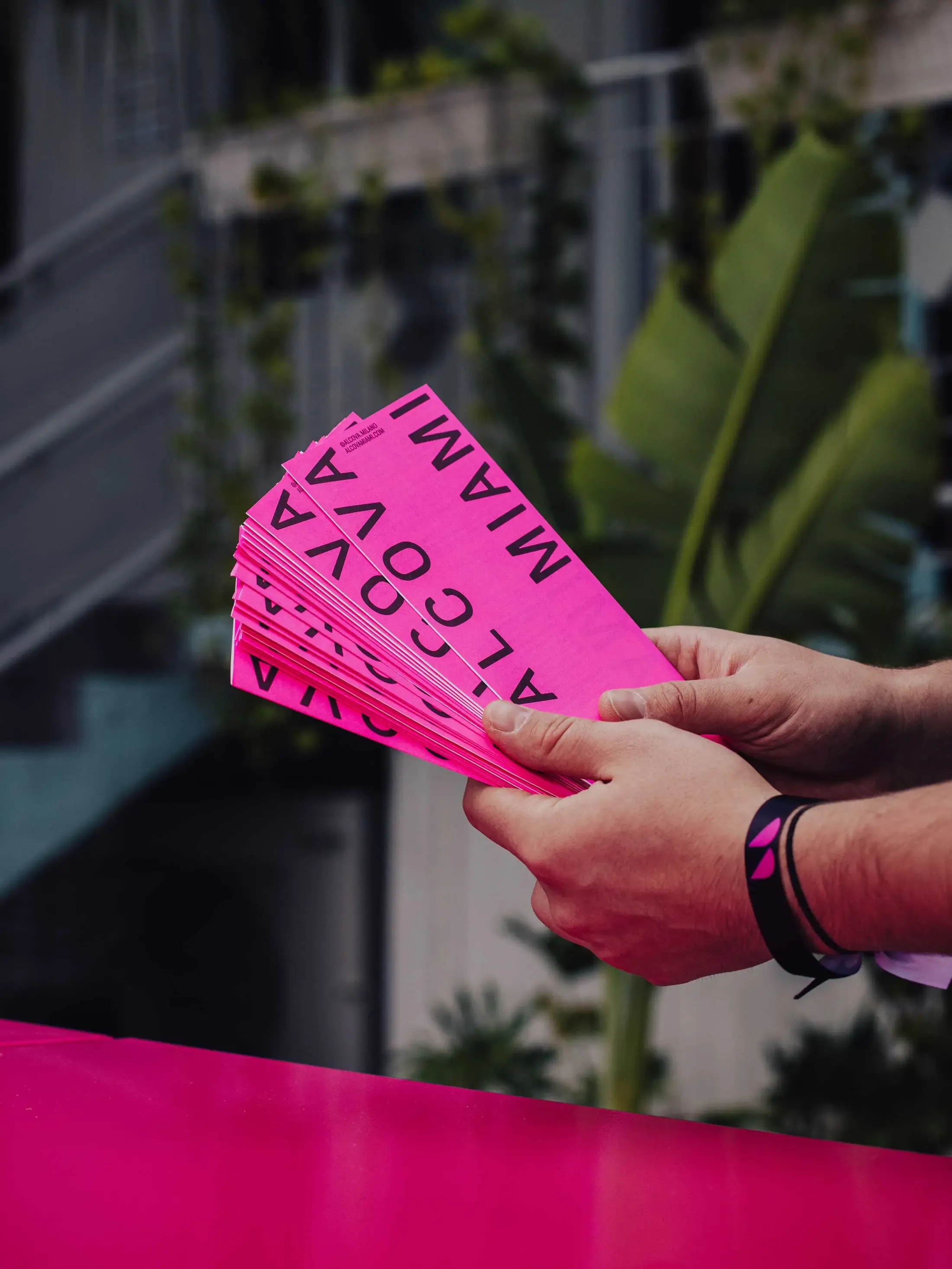 Folded pink-themed map of Alcova Miami 2023 exhibition for visitor guidance | Carlotta Bacchini