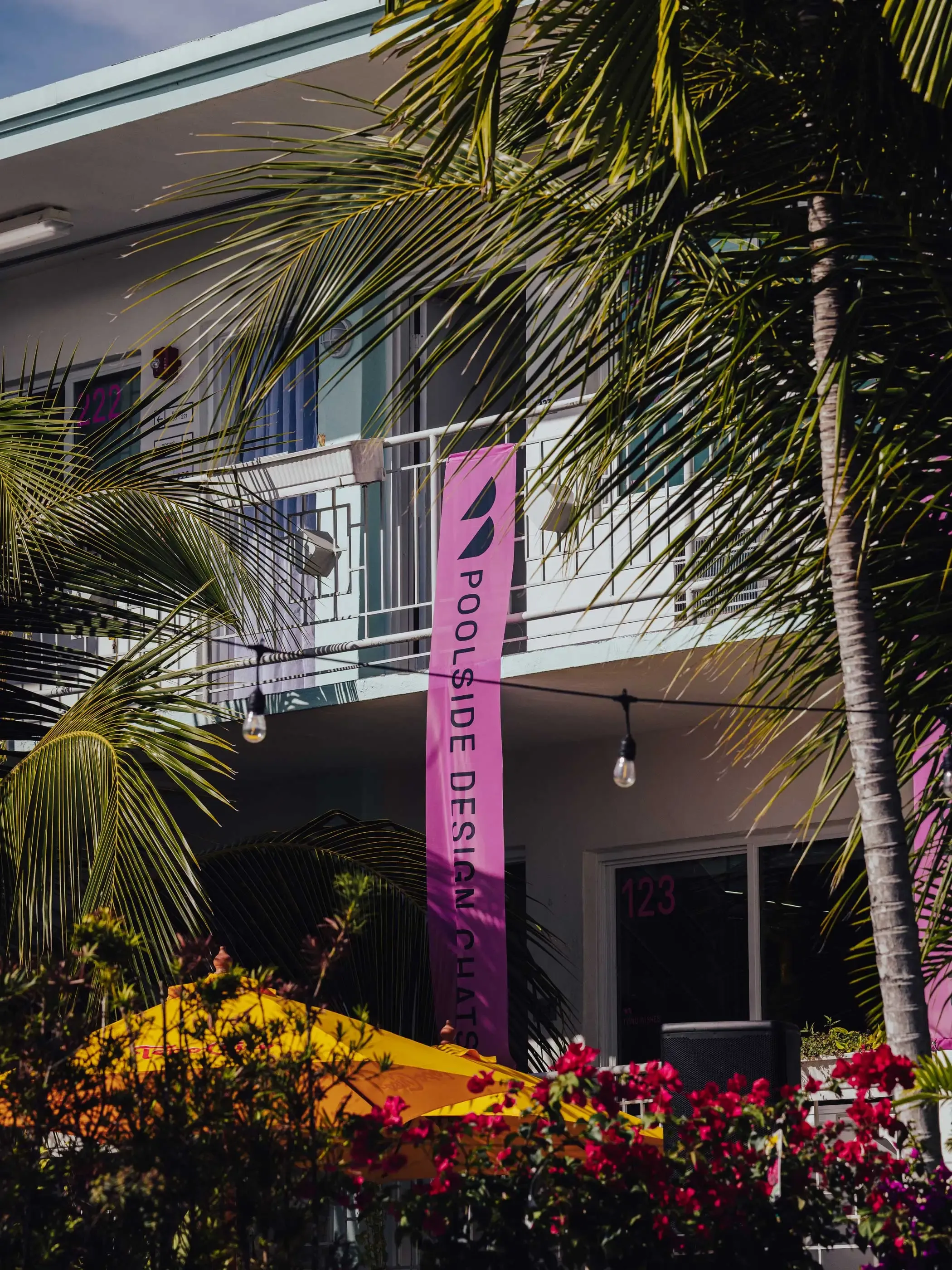 Pink banner with Alcova Miami 2023 logo for talk area at design event | Carlotta Bacchini