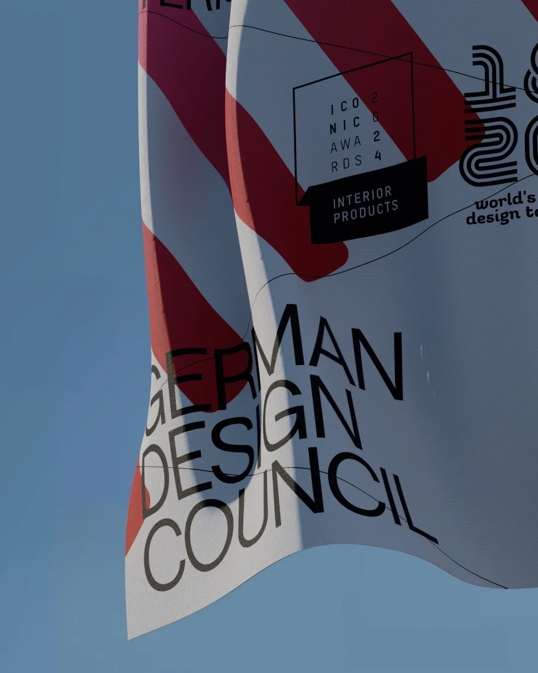 Close-up of inflatable banner with red stripes and warped typography for German Design Council exhibition identity | Carlotta Bacchini