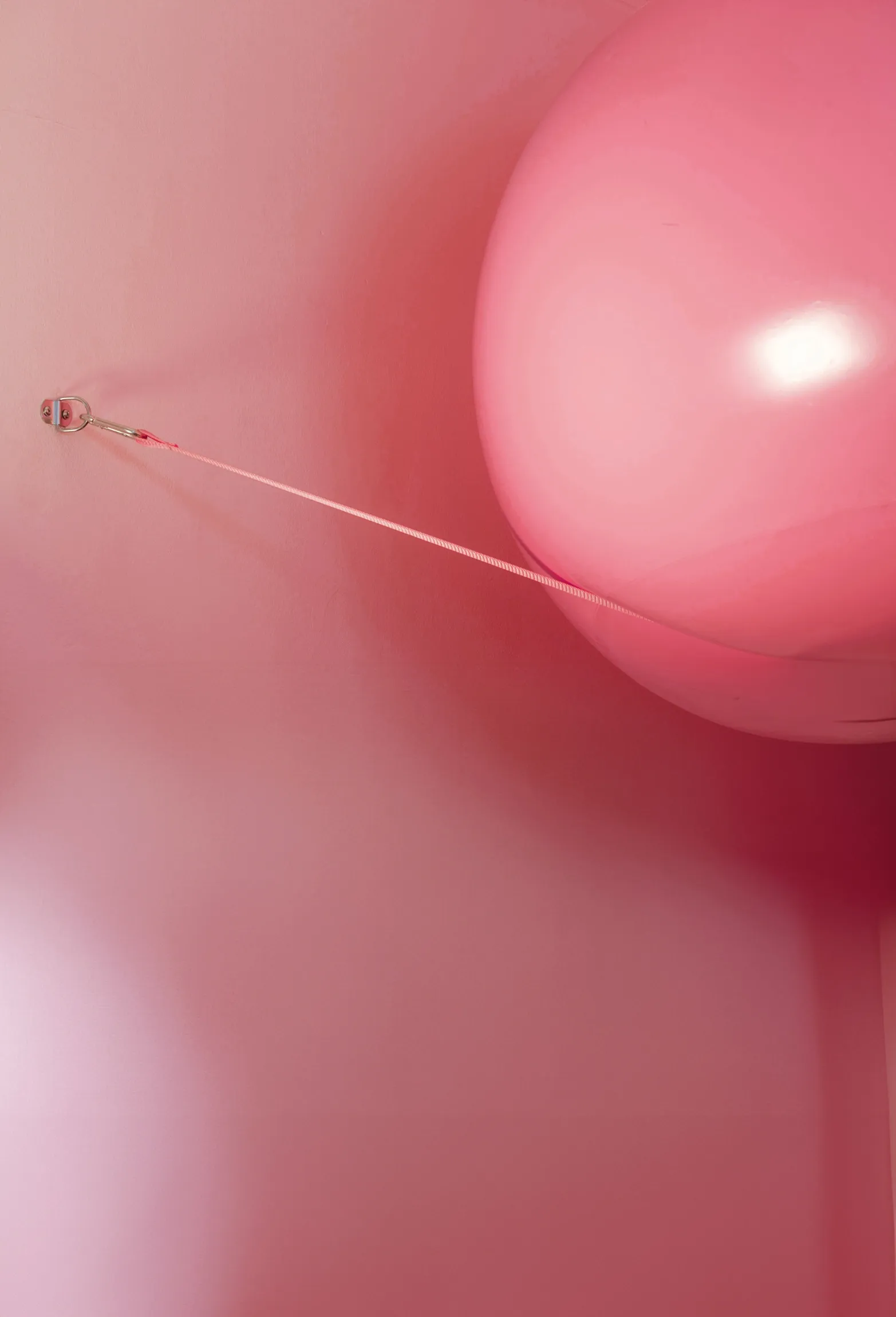 Inflatable pink balloon as part of exhibition design by Objects of Common Interest for German Design Council at Milan Design Week | Carlotta Bacchini
